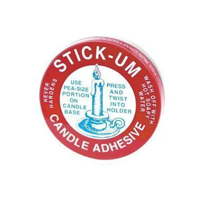 Stick-Um Candle Adhesive container with red lid and white label on a white background