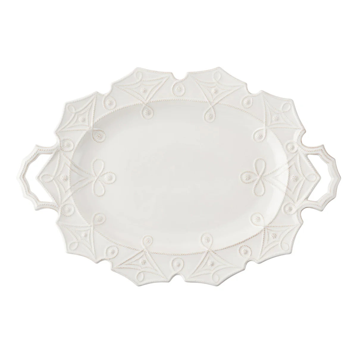 White decorative plate with intricate patterns on a white background