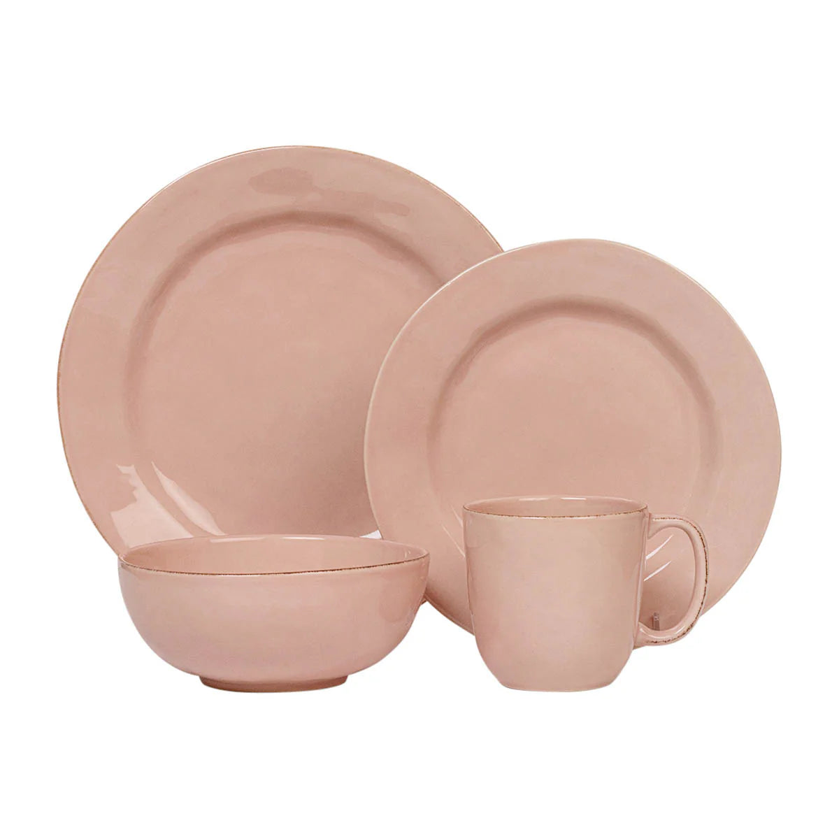 Pink ceramic dinnerware set on a white background