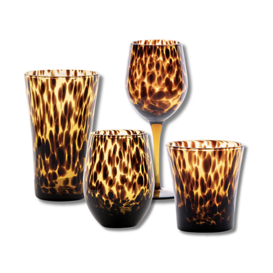 Set of four tortoiseshell patterned glasses on a white background