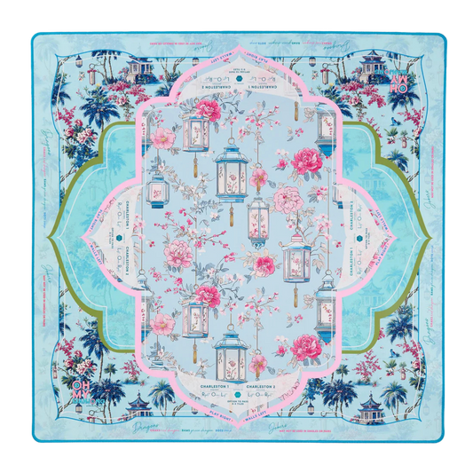 Decorative tablecloth with floral and lantern design on a blue background