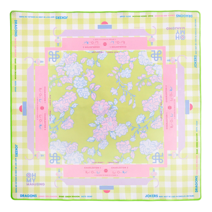 Floral design mahjong on a green background with pink accents