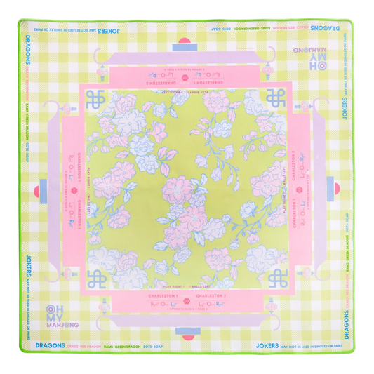 Floral design mahjong on a green background with pink accents