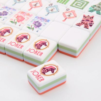 Colorful game pieces with 'Joker' and animal illustrations on a white background