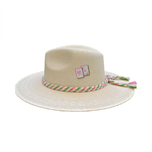 Beige straw hat with a colorful braided band on a white background