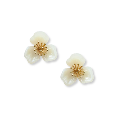 Floral earrings with gold centers on a white background